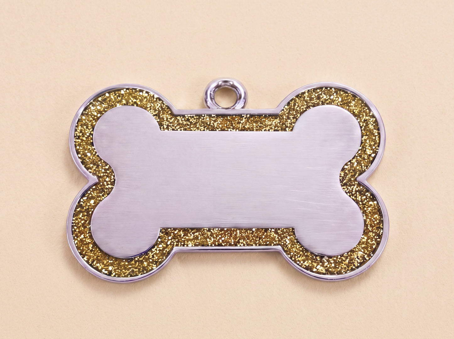 Botvormige hondenpenning met glitterrand en blanco midden, goud