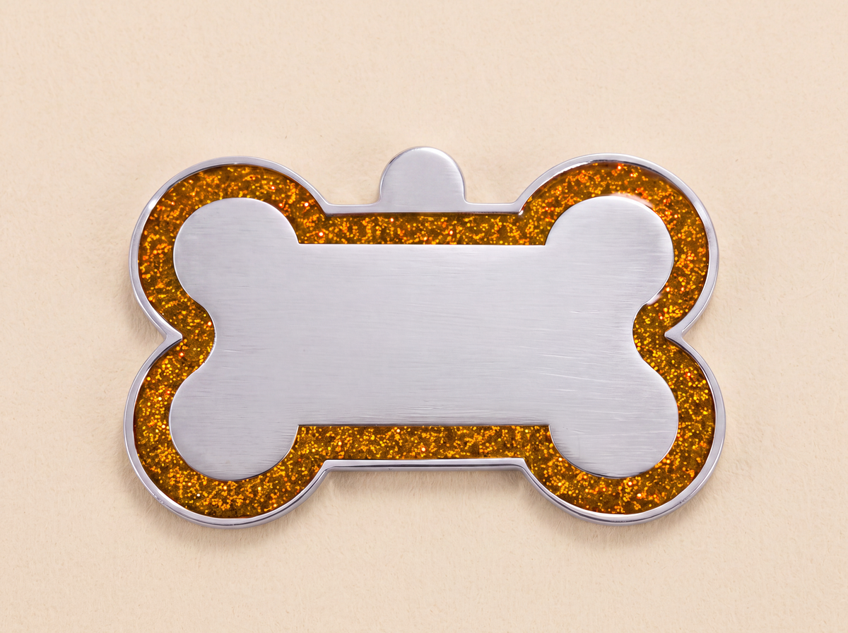 Botvormige hondenpenning met glitterrand en blanco midden, oranje