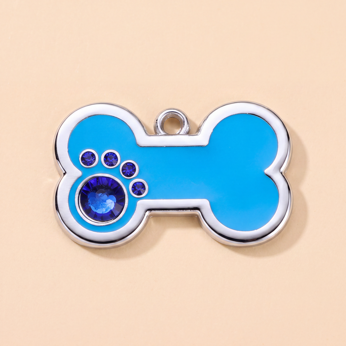 Botvormige hondenpenning met strass-steentjes rondom, blauw