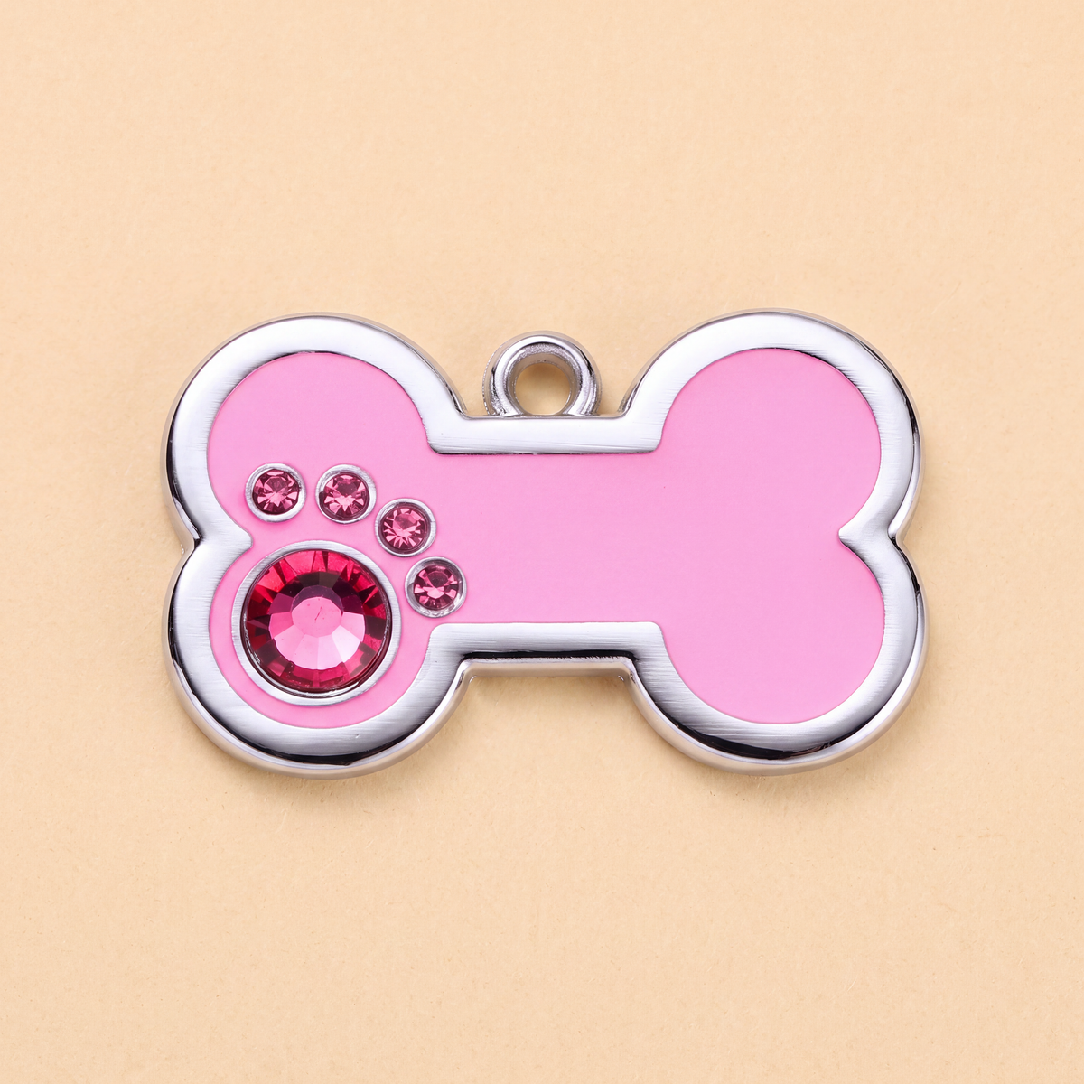Botvormige hondenpenning met strass-steentjes rondom, roze