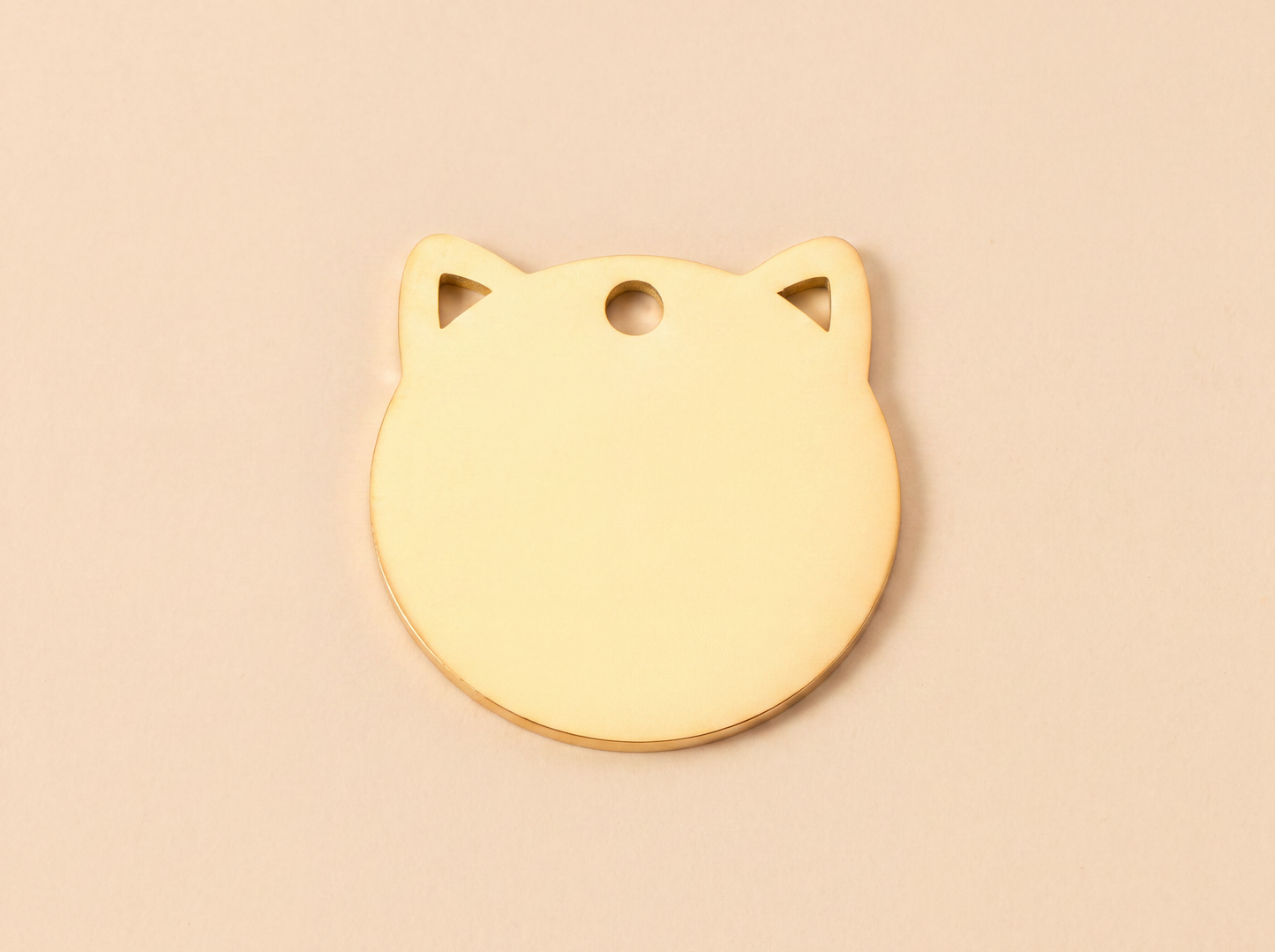 Kattenpenning in kattenkopvorm van roestvrij staal, goud